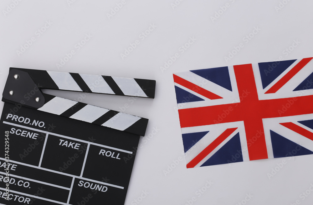 Movie clapper board and British flag on white background. Filmmaking, Movie production, Entertainment industry. Top view