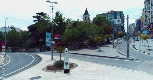 Empty square with statue in Kadikoy Bahariye, Istanbul city, Turkey, during Covid-19 Coronavirus outbreak photo