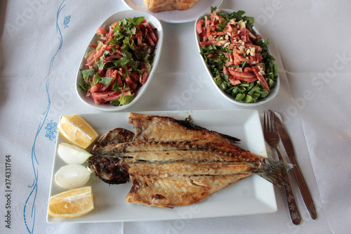 delicious fish and salads on presentation plate
