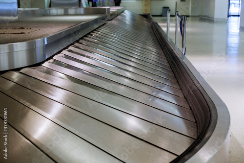 Baggage conveyor waiting for on airport after arrival to airport destination flight