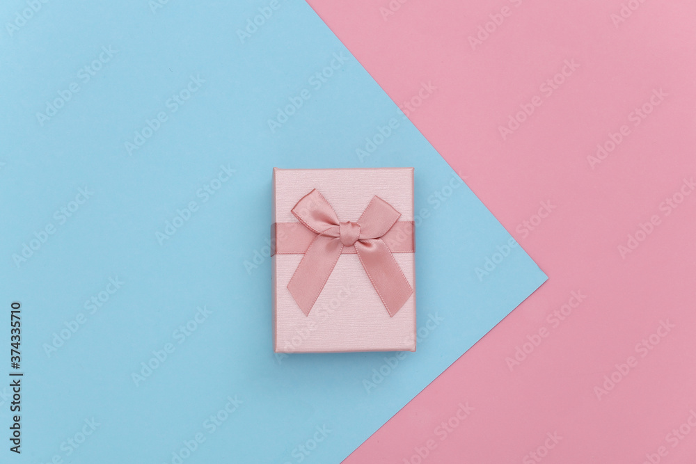 Gift box on pink blue pastel background. Top view. Gift box on pink blue pastel background. Top view.