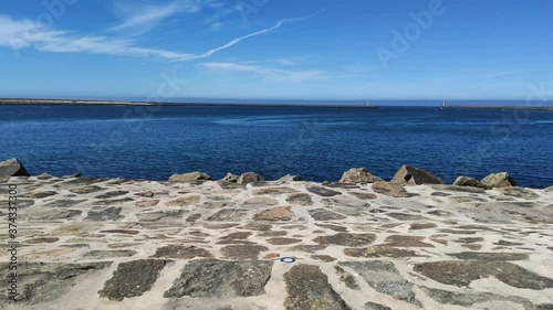 Lighthouses at the Douro River Mouth (Foz do Douro), Porto, Portugal. The North jetty at Barra do Douro on the north bank and the Pontao Lighthouse. photo