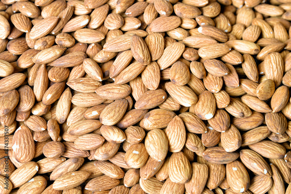 Almonds as a very stylish background of natural products in a beautiful color. Almonds as a very stylish background of natural products in a beautiful color.