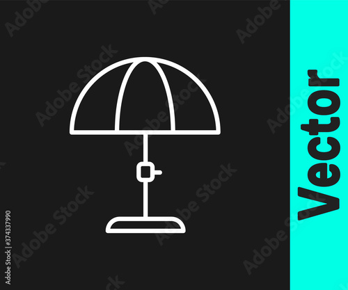 White line Sun protective umbrella for beach icon isolated on black background. Large parasol for outdoor space. Beach umbrella. Vector.
