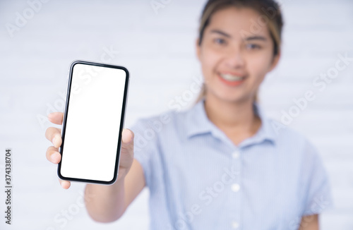 women holding phone showing white screen