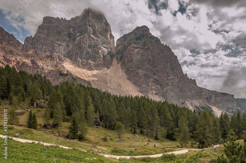 Monte Pelmo, an impressive and isolated mountain as seen from Rifugio Cima di Fiume at the end of stage six of Alta Via 1 classic trek in the Dolomites, province of Belluno, South Tirol, Italy.