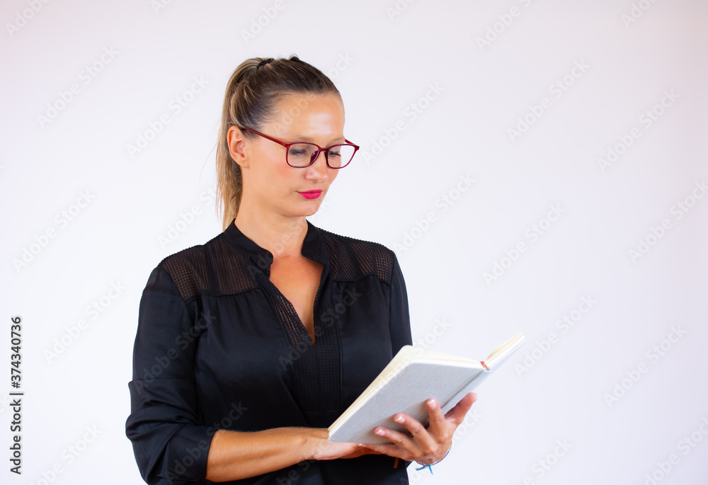 Pretty businesswoman with a notebook on white background Pretty businesswoman with a notebook on white background