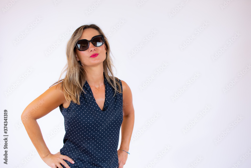 Beautiful woman in blue shirt and sunglasses posing Beautiful woman in blue shirt and sunglasses posing