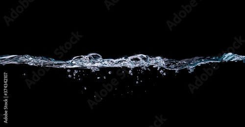 Water drinking, Water wave splash isolated black background. 