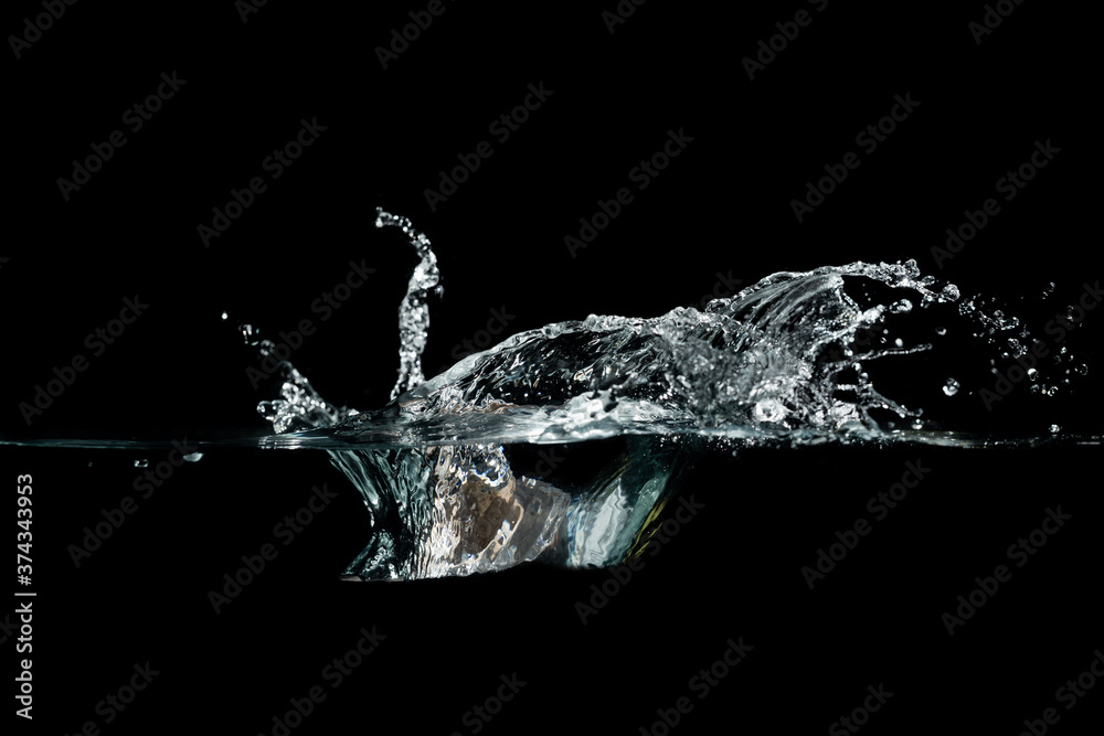 close up of water waves splash and bubbles isolated on black background. close up of water waves splash and bubbles isolated on black background.
