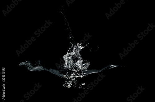 close up of water splash and bubbles isolated on black background © Suprachai