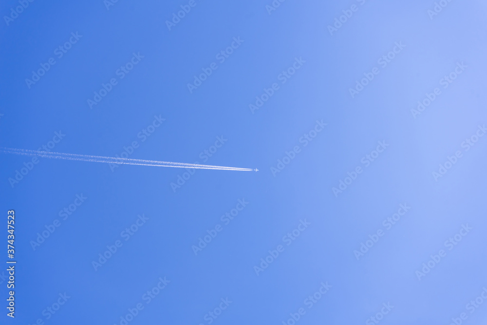 clear blue sky background with a plane. tone blue background. tone blue wallpaper. clear blue sky background with a plane. tone blue background. tone blue wallpaper.