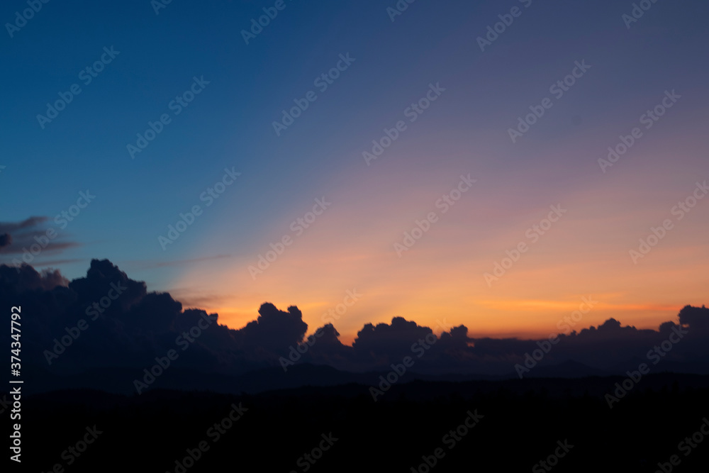 Land with and dramatic colorful sky at sunset