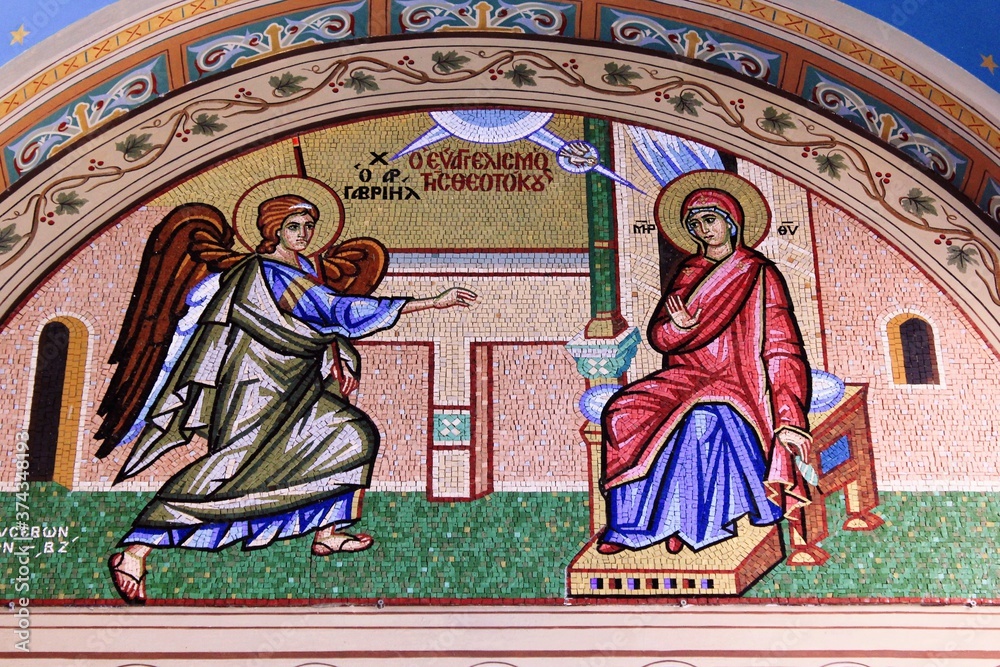 Beautiful mosaic showing  the Annunciation to the Virgin Mary outside of  Christian orthodox church - Athens, Greece, August 11 2020.