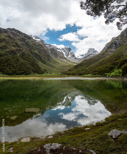 Reflection of Emily Peak in Lake Mackenzie at the famous Routeburn Track, Fjordland National Park, Southland/New Zealand