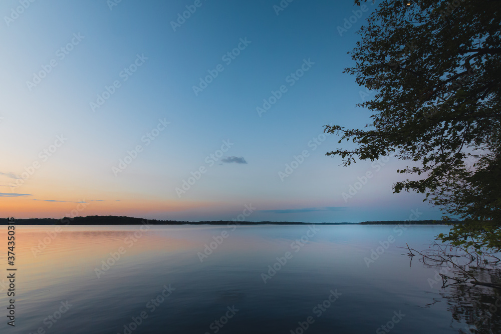 Calm lake water at sunset