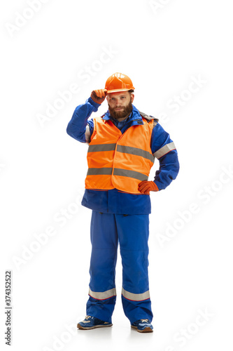 Handsome contractor, builder isolated over white studio background. Concept of professional occupation, work, job, building, investment. Copyspace for ad, text. Caucasian man wearing equipment.