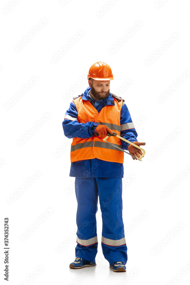 Handsome contractor, builder isolated over white studio background. Concept of professional occupation, work, job, building, investment. Copyspace for ad, text. Caucasian man wearing equipment. Handsome contractor, builder isolated over white studio background. Concept of professional occupation, work, job, building, investment. Copyspace for ad, text. Caucasian man wearing equipment.