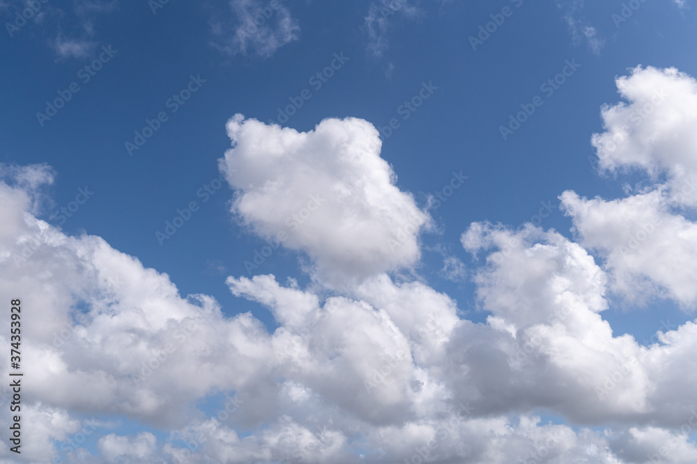 Obraz premium Beautiful Blue sky with bright clouds. Cloudscape background. Copy space