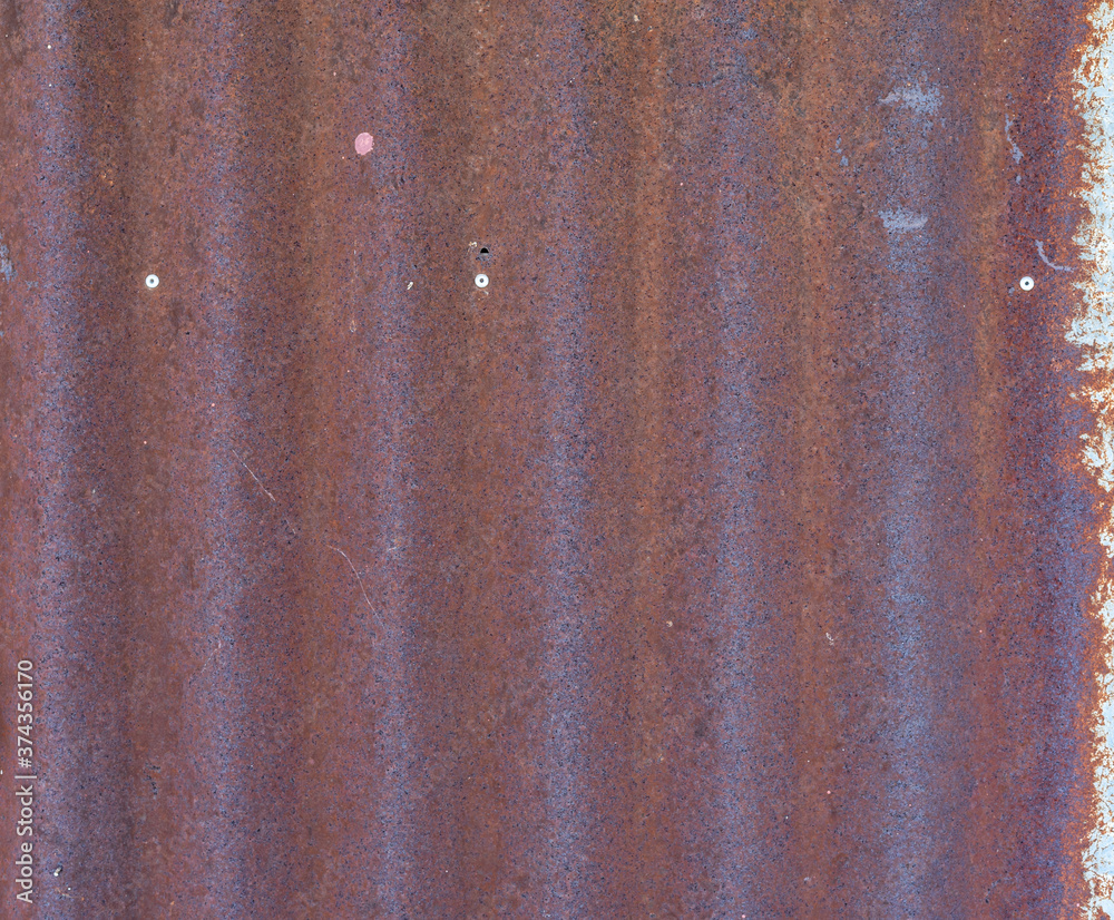 Naklejka premium Old rust texture on brown background.