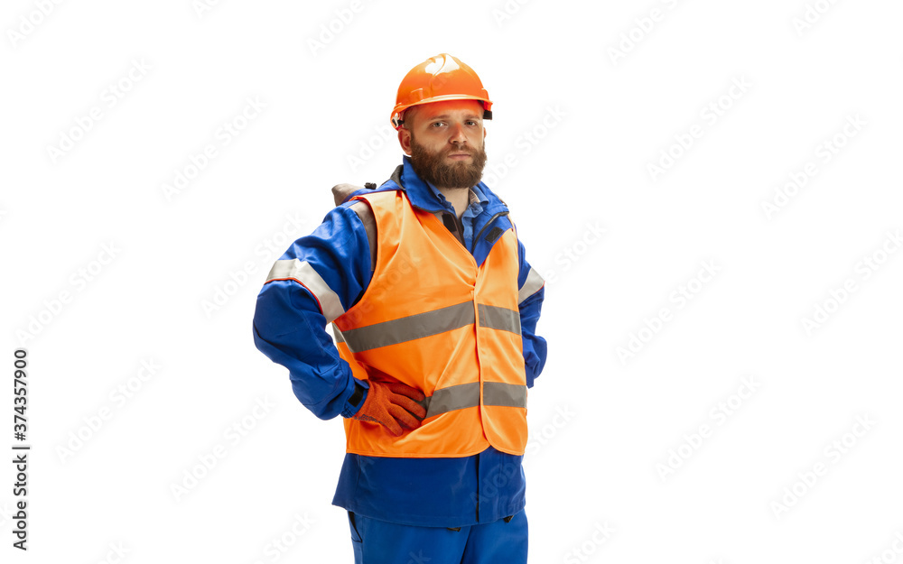 Handsome contractor, builder isolated over white studio background. Concept of professional occupation, work, job, building, investment. Copyspace for ad, text. Caucasian man wearing equipment.