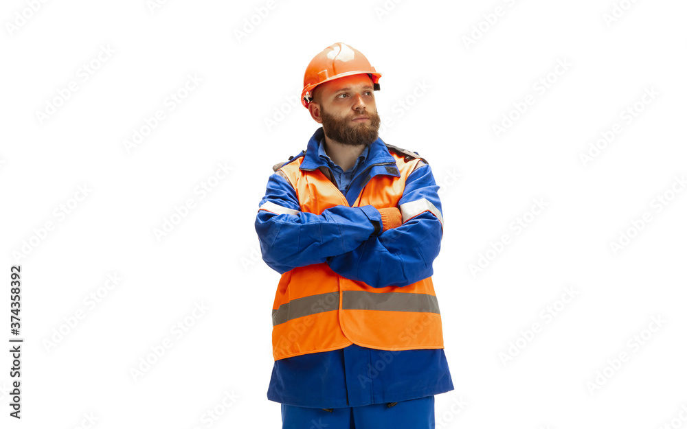 Handsome contractor, builder isolated over white studio background. Concept of professional occupation, work, job, building, investment. Copyspace for ad, text. Caucasian man wearing equipment.