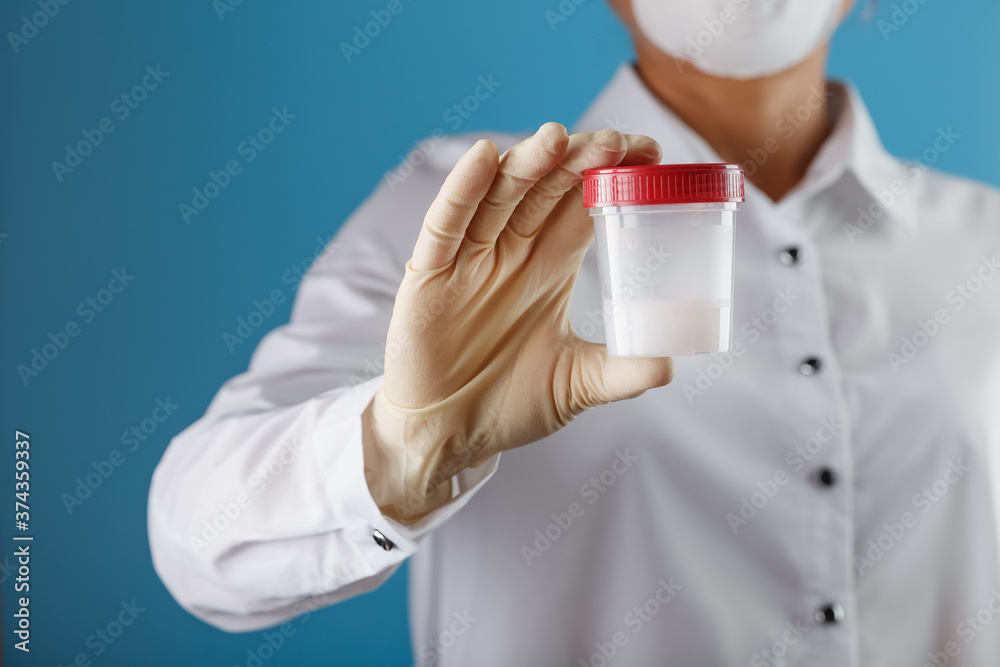 Semen analysis in a Bank is held in the hand of a doctor. Infertility. Semen analysis in a Bank is held in the hand of a doctor. Infertility.