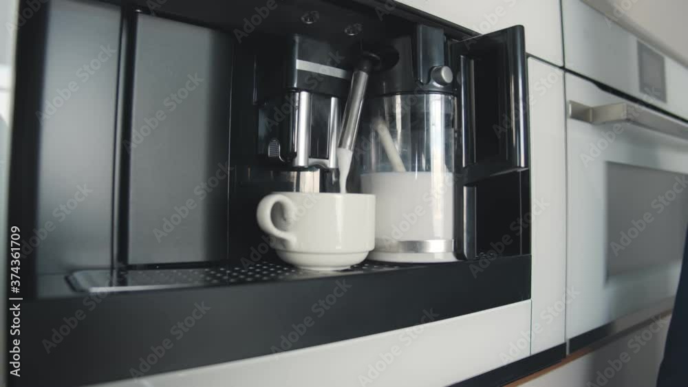 Process of automatic coffee machine preparing milk foam for cappuccino Process of automatic coffee machine preparing milk foam for cappuccino
