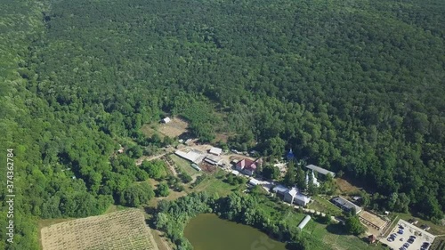 Aerial view of christian monastery. The lake and a view of the Thiganeshty Monastery. Moldova. photo