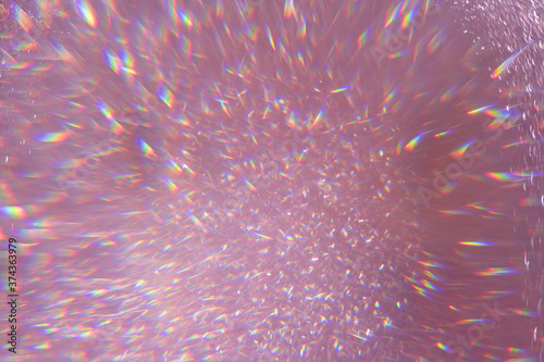 Defocused pink sequins,flares highlights sparkling carpet. Close-up, very shallow depth of field . Macro.