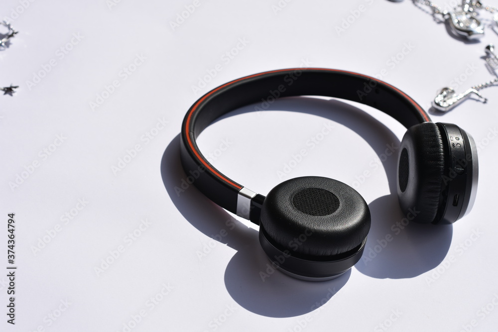 Music and Christmas, headphones on white background. Music and Christmas, headphones on white background.