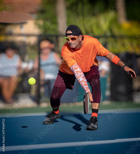 Professional Pickleball player, Dominic Castelano, reaches for a backhand during tournament © Jo