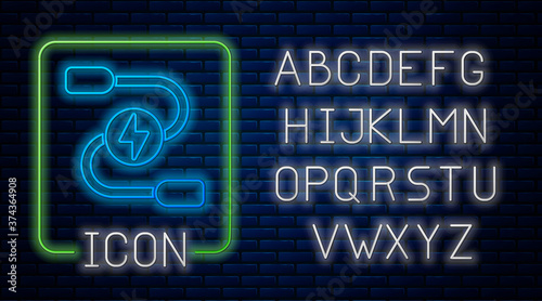 Glowing neon Car battery jumper power cable icon isolated on brick wall background. Neon light alphabet. Vector.