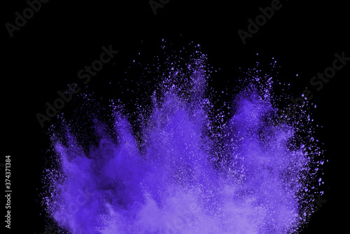 Freeze motion of purple color powder exploding on black background.