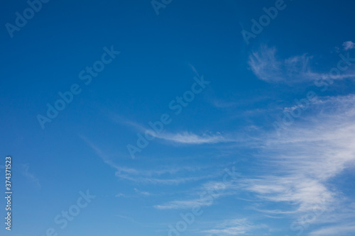 a sunny blue sky with some soft clouds