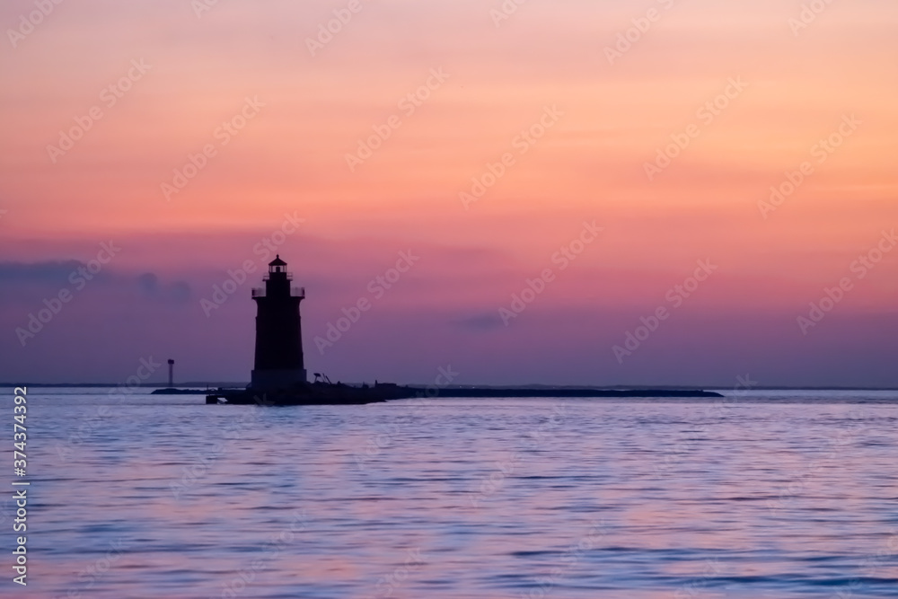 Lewes Delaware Breakwater Lighthouse in soft sunset Lewes Delaware Breakwater Lighthouse in soft sunset