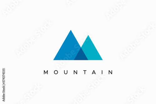 Abstract Mountain Logo. Blue Geometric Initial Letter M Origami Style isolated on White Background. Flat Vector Logo Design Template Element