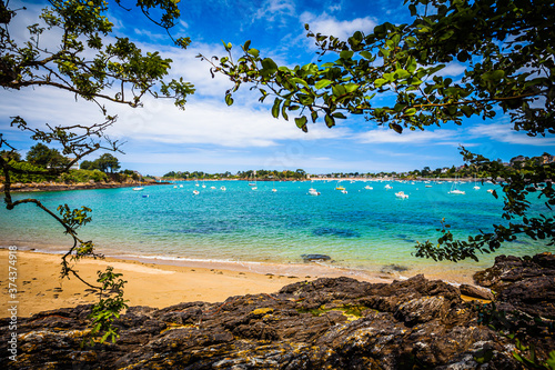 Small bay with boats at the emerald coast in Brittany, France