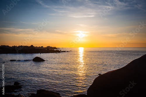 Colourful sunset at the Cote de Granit Rose at the coast of Brittnay  France