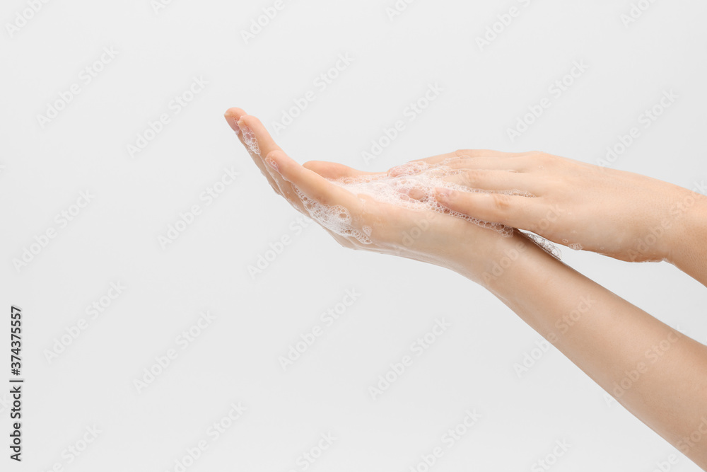 Lathering hands, process. Hands washing gesture, soapy female hand foam.