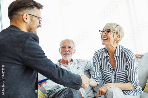 handshake senior couple investment business finance hand agent meeting agreement planning home