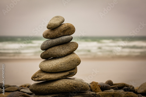 Man-made pile (or stack) of stones called cairn in Brittany, France
