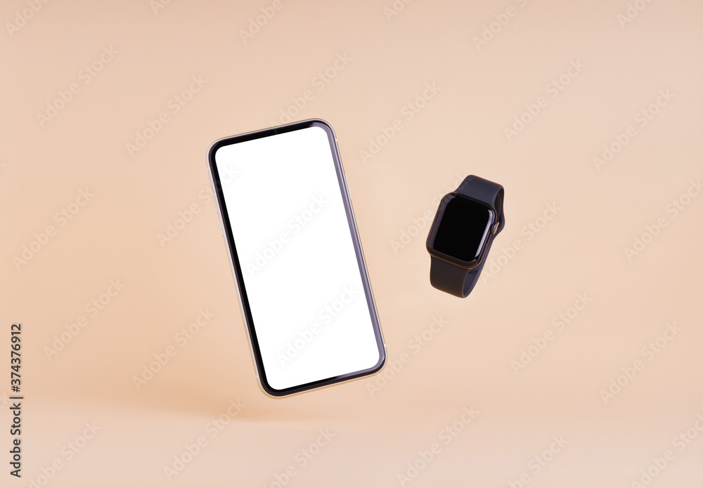smart phone and smart watch on cream color background Stock Photo