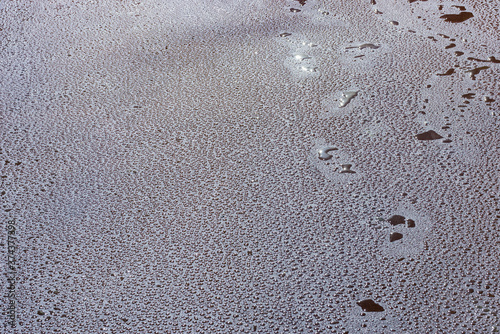 Water drops on the new asphalt road surface.