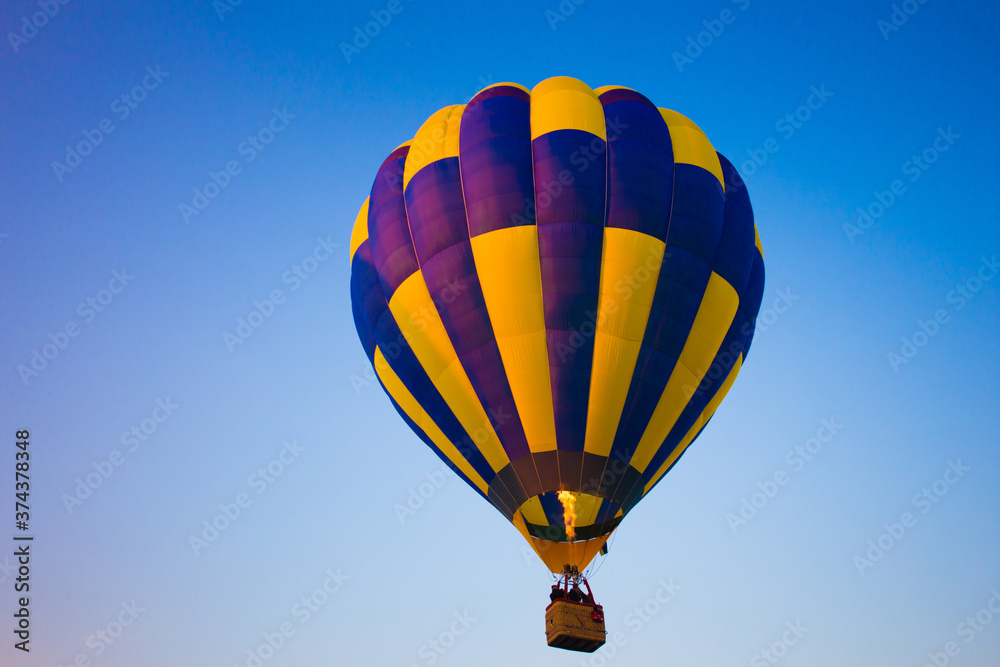 Fototapeta premium Big balloon flies against the sky