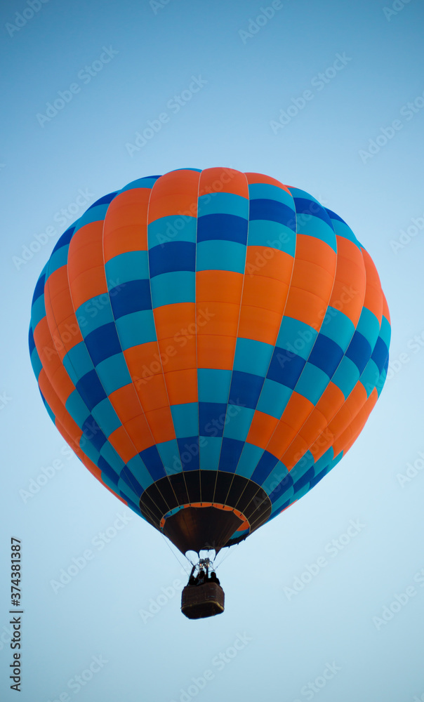 Fototapeta premium Big balloon flies against the sky