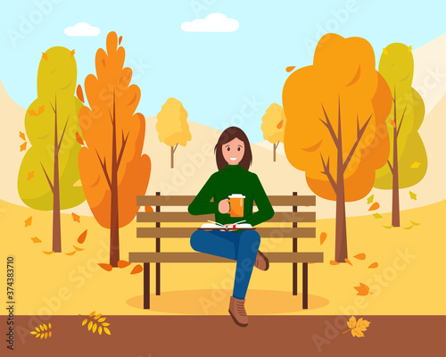 Woman with book and coffee in park.
