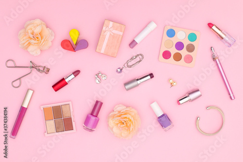 Fototapeta Naklejka Na Ścianę i Meble -  Pastel make up products on pink theme 