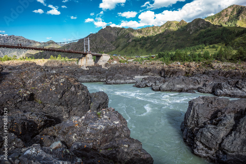 Mountain landscape with a bridge over the Katun river. Altai Republic photo