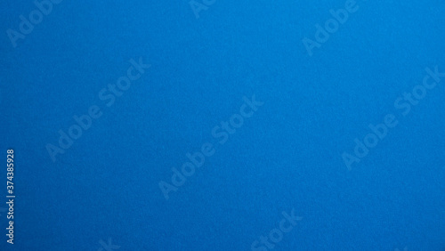 Blue matte suede fabric background, close-up. Velvety texture